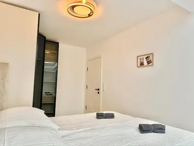 Ein Bett oder Betten in einem Zimmer der Unterkunft Luxury Rooftop Apartment with Balcony - 15 min to Center