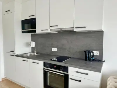 Küche/Küchenzeile in der Unterkunft Luxury Rooftop Apartment with Balcony - 15 min to Center