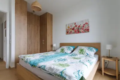 Ein Bett oder Betten in einem Zimmer der Unterkunft Sunny Oasis, 60 sq m Private Terrace, Park View