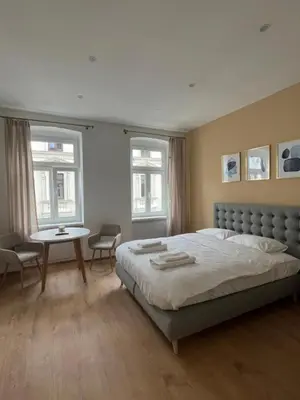 Ein Bett oder Betten in einem Zimmer der Unterkunft Apartment near Metro & Netflix - Kingsize Bed
