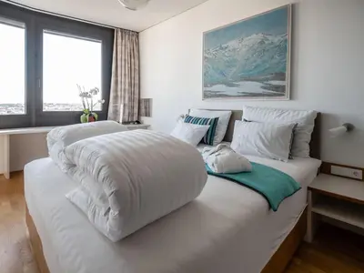 Ein Bett oder Betten in einem Zimmer der Unterkunft Apartment Skyflats Sun View by Interhome