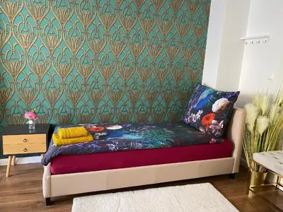Ein Bett oder Betten in einem Zimmer der Unterkunft Royal Vienna Schönbrunn Apartment