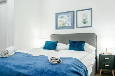 Ein Bett oder Betten in einem Zimmer der Unterkunft 10-Min to Westbahnhof, Modern Hotel Rooms with TV, Wi-Fi