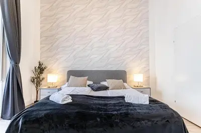 Ein Bett oder Betten in einem Zimmer der Unterkunft 10-Min to Westbahnhof, Modern Hotel Rooms with TV, Wi-Fi