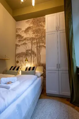 Ein Bett oder Betten in einem Zimmer der Unterkunft josef's home l Historic Dream in Prime Location
