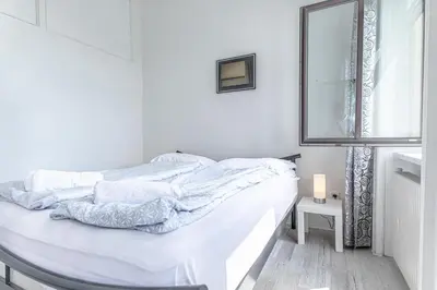 Ein Bett oder Betten in einem Zimmer der Unterkunft Comfortable Private Rooms Near Millennium Tower for Long Stays
