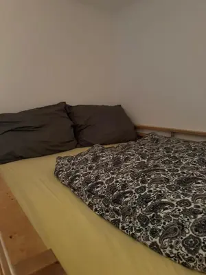 Ein Bett oder Betten in einem Zimmer der Unterkunft Małe M