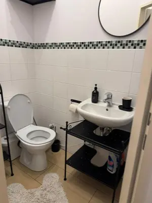 Ein Badezimmer in der Unterkunft Małe M