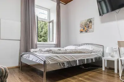 Ein Bett oder Betten in einem Zimmer der Unterkunft Modern 1BR Apartment Close to the Danube River