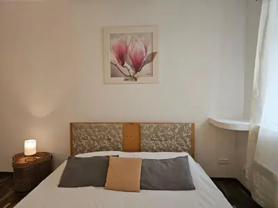 Ein Bett oder Betten in einem Zimmer der Unterkunft Chopin Apartment