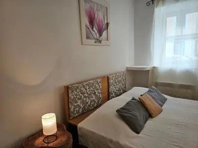 Ein Bett oder Betten in einem Zimmer der Unterkunft Chopin Apartment