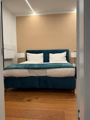 Ein Bett oder Betten in einem Zimmer der Unterkunft Laura Star Apartment