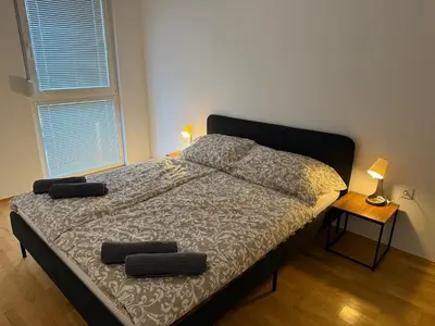 Ein Bett oder Betten in einem Zimmer der Unterkunft QuietApt Vienna