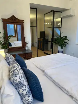 Ein Bett oder Betten in einem Zimmer der Unterkunft Amadeus Studio