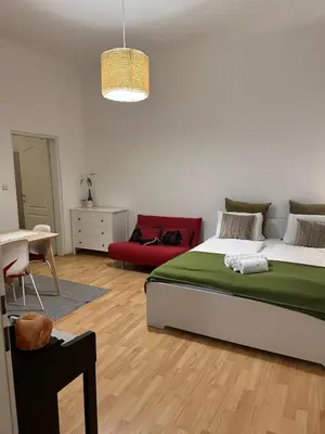 Ein Bett oder Betten in einem Zimmer der Unterkunft Viennese Nest Apartment