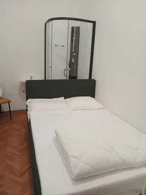 Ein Bett oder Betten in einem Zimmer der Unterkunft City Residence Home