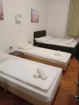 Ein Bett oder Betten in einem Zimmer der Unterkunft City Residence Home