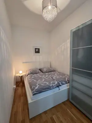 Ein Bett oder Betten in einem Zimmer der Unterkunft Apartment Schönbrunn - geräumig und liebevoll dekoriert in Zentrumsnähe