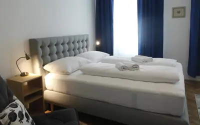 Ein Bett oder Betten in einem Zimmer der Unterkunft Casa Nostra - Schöne 3-Zimmerwohnung am Augarten