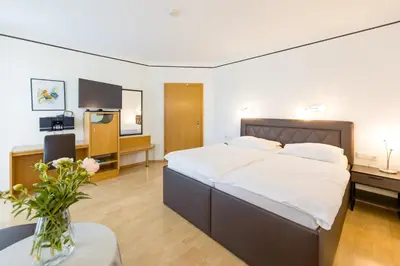 Ein Bett oder Betten in einem Zimmer der Unterkunft Gästehaus Wutschitz