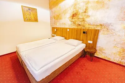 Ein Bett oder Betten in einem Zimmer der Unterkunft Hotel Klimt