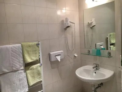 Ein Badezimmer in der Unterkunft Pension Ani-Falstaff