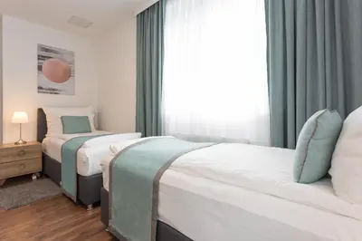 Ein Bett oder Betten in einem Zimmer der Unterkunft Mar Suite Apartments - Simmering