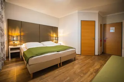 Ein Bett oder Betten in einem Zimmer der Unterkunft Arion Airport Hotel