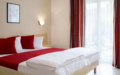 Ein Bett oder Betten in einem Zimmer der Unterkunft Landhaus Pannonia