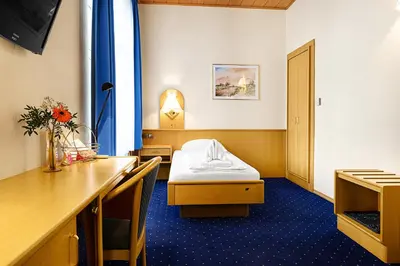 Ein Bett oder Betten in einem Zimmer der Unterkunft Hotel-Pension Wild