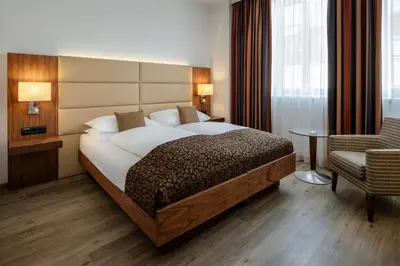 Ein Bett oder Betten in einem Zimmer der Unterkunft Hotel IMLAUER Wien