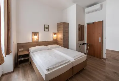 Ein Bett oder Betten in einem Zimmer der Unterkunft Hotel Terminus