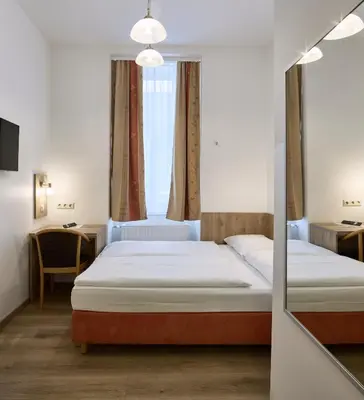 Ein Bett oder Betten in einem Zimmer der Unterkunft Hotel Terminus