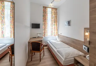 Ein Bett oder Betten in einem Zimmer der Unterkunft Hotel Terminus