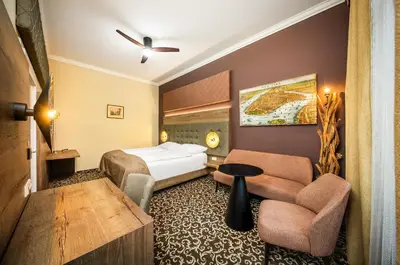 Ein Bett oder Betten in einem Zimmer der Unterkunft Das Gutenbrunn Thermen & Sporthotel