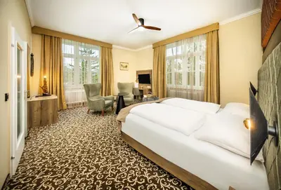 Ein Bett oder Betten in einem Zimmer der Unterkunft Das Gutenbrunn Thermen & Sporthotel
