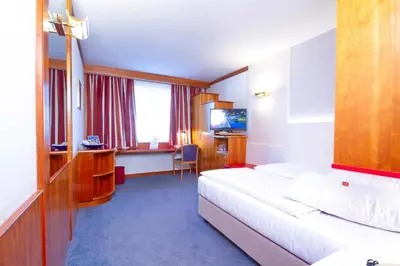 Ein Bett oder Betten in einem Zimmer der Unterkunft Vienna Sporthotel