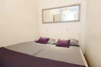 Ein Bett oder Betten in einem Zimmer der Unterkunft City Apartment