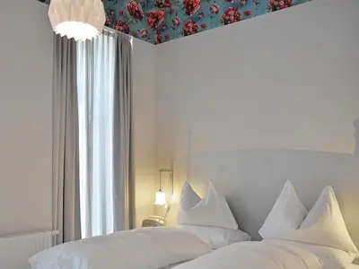 Ein Bett oder Betten in einem Zimmer der Unterkunft grätzlhotel Meidlinger Markt