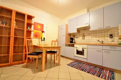 Küche/Küchenzeile in der Unterkunft AJO Apartments - Alte Donau Garden Flat - Self-Check-in