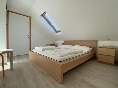 Ein Bett oder Betten in einem Zimmer der Unterkunft Storchencamp Gästehaus Rust