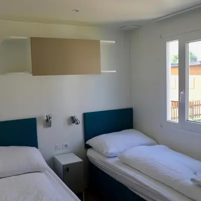 Ein Bett oder Betten in einem Zimmer der Unterkunft Storchencamp Gästehaus Rust