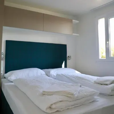 Ein Bett oder Betten in einem Zimmer der Unterkunft Storchencamp Gästehaus Rust