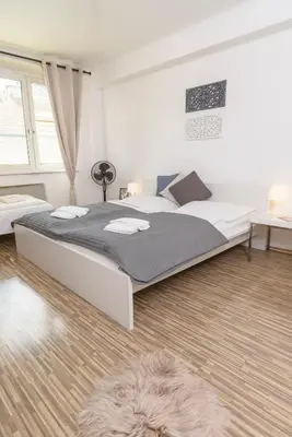 Ein Bett oder Betten in einem Zimmer der Unterkunft Cosy Margareten