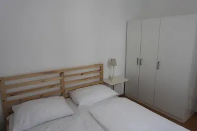 Ein Bett oder Betten in einem Zimmer der Unterkunft Casa Nostra - Ruhige Stadtwohnung mit Balkon