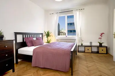 Ein Bett oder Betten in einem Zimmer der Unterkunft OPERASTREET CITY CENTER Apartment 