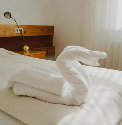 Ein Bett oder Betten in einem Zimmer der Unterkunft Pension Müller Gartner