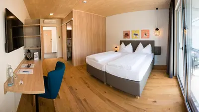 Ein Bett oder Betten in einem Zimmer der Unterkunft Hotel Katamaran