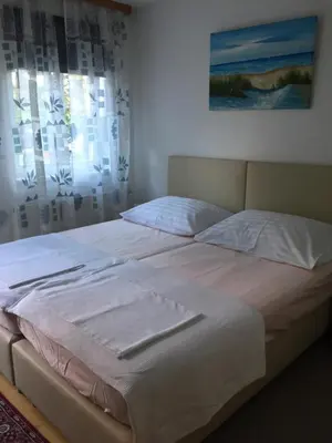 Ein Bett oder Betten in einem Zimmer der Unterkunft Terrasse Wohnungen mit parking in Zentrum