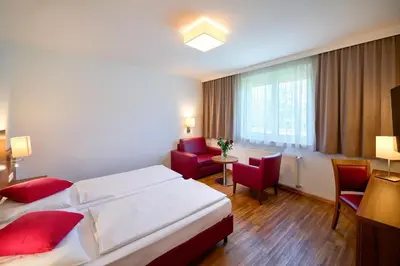 Ein Bett oder Betten in einem Zimmer der Unterkunft KSV Hotel Wien